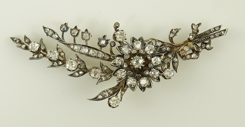 A Victorian gold, silver and diamond cluster foliate spray brooch